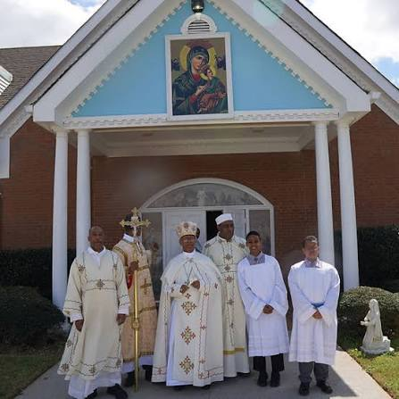 Clergy in front of the Habesha Catholic church